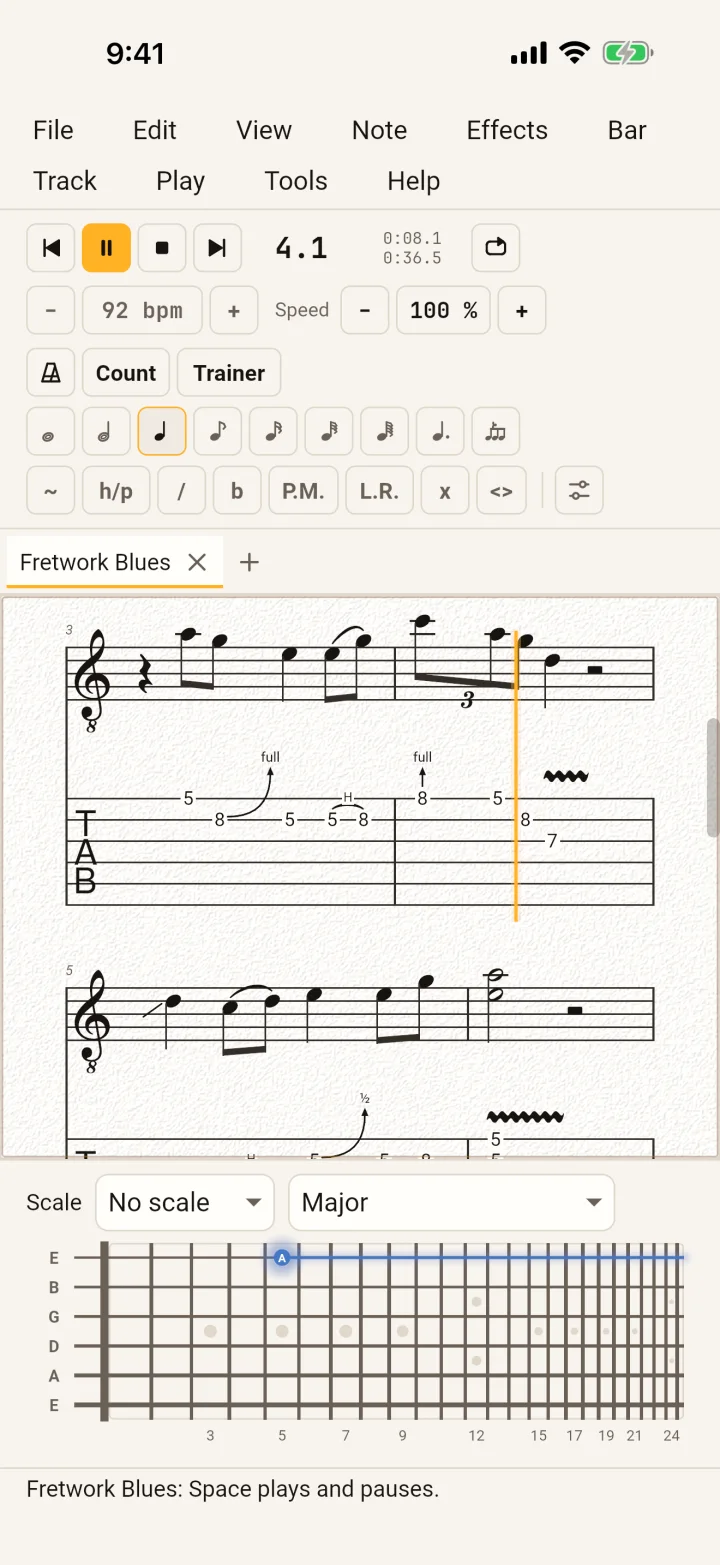 GuitarLab on an iPhone, playing the blues: the transport with Pause lit, the score with the amber playback cursor in bar 4, and the fretboard below.